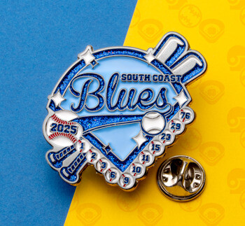 Custom baseball trading pin for South Coast Blues featuring a blue glitter diamond, crossed bats, and small baseballs with jersey numbers.