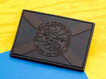 Rectangular black PVC patch featuring the Great Seal of the State of Florida with a saltire background.