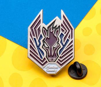 Soft enamel lapel pin featuring a purple and white stylized horse head with wings and Marion County text.