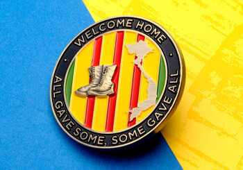 Vietnam Veterans commemorative challenge coin featuring military boots, the map of Vietnam, and the words Welcome Home, All Gave Some, Some Gave All.