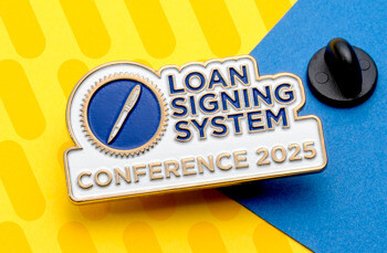 Loan Signing System Conference 2025 custom lapel pin with a blue pen logo and gold border next to a black rubber clutch.